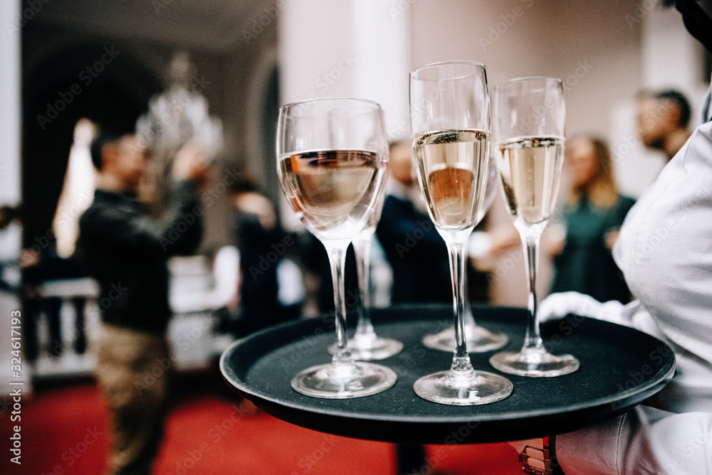 Full glasses of champagne on tray Full glasses of champagne on tray