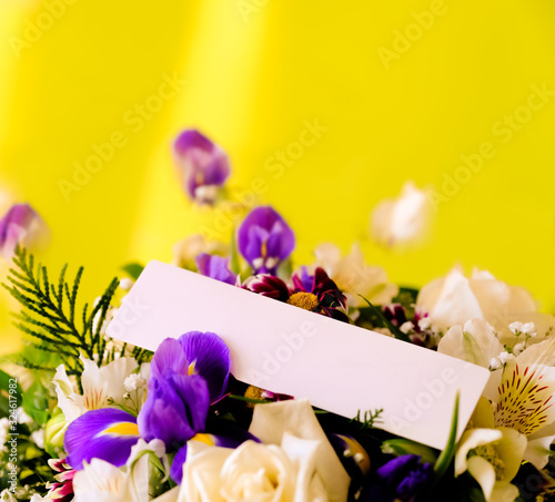 Bright, Beautiful bouquet with an empty white card. with blank white card to put your message.