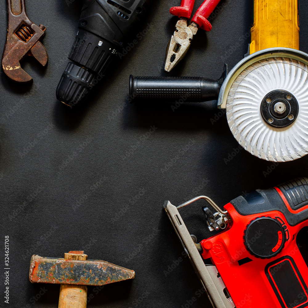 Construction worker tools on a dark background top view. Construction worker tools on a dark background top view.