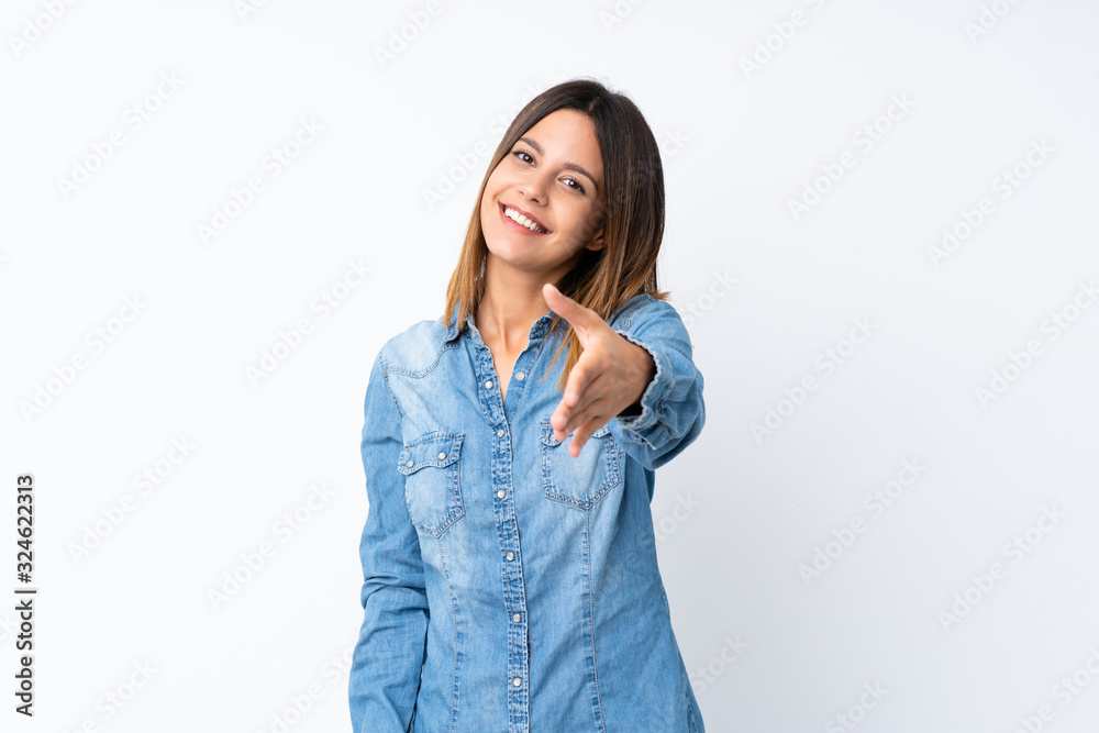 Young woman over isolated white background shaking hands for closing a good deal Young woman over isolated white background shaking hands for closing a good deal