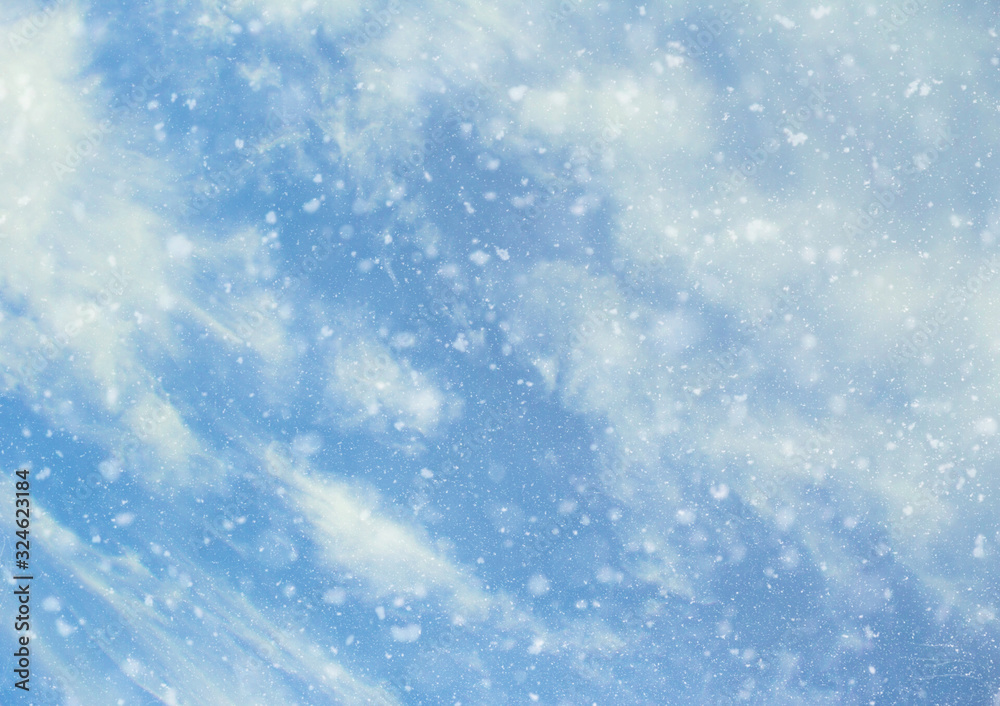 Blue sky background with clouds and snow. Winter blue lights view, de-focused Blue sky background with clouds and snow. Winter blue lights view, de-focused
