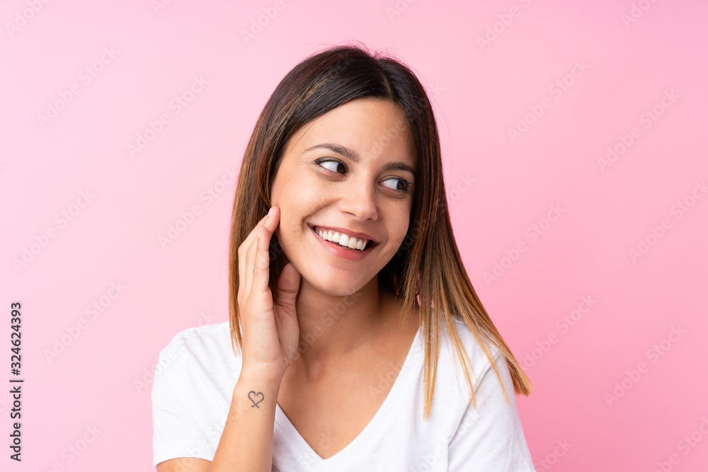 Young woman over isolated pink background Young woman over isolated pink background