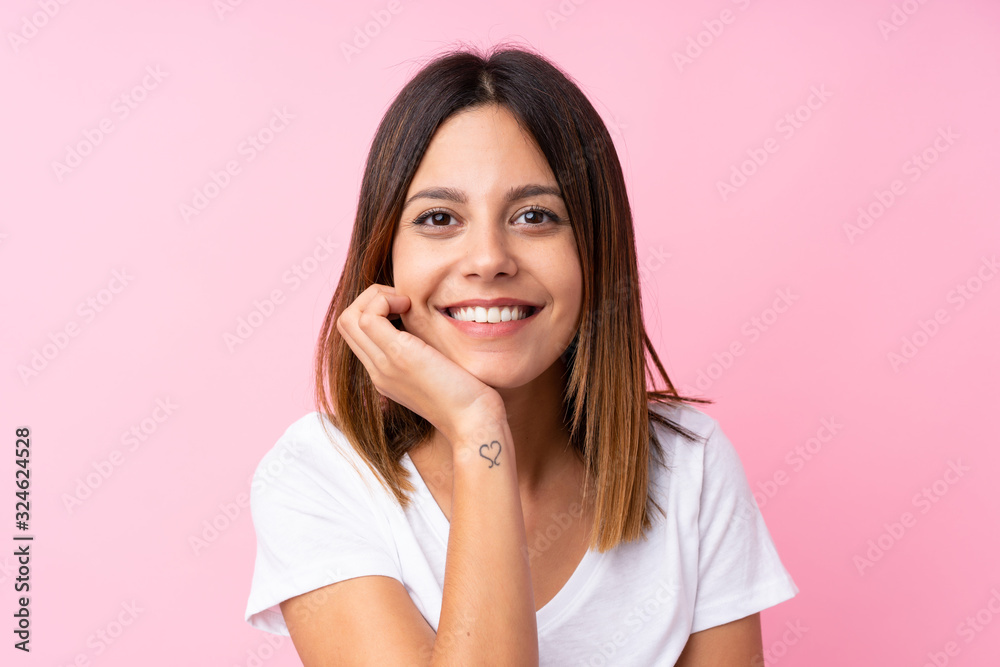 Young woman over isolated pink background Young woman over isolated pink background