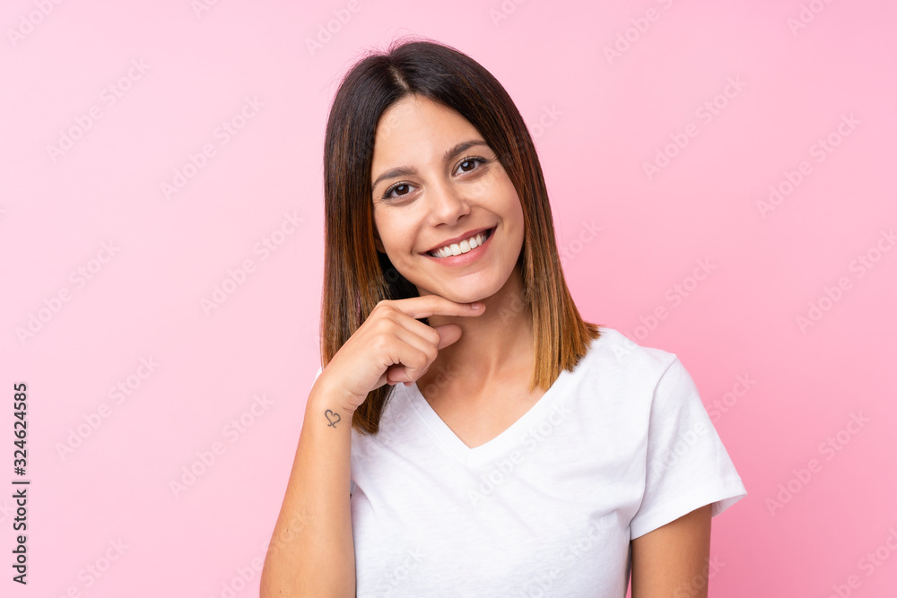 Young woman over isolated pink background Young woman over isolated pink background