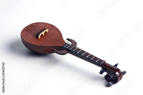 detail of rebab, arabic musical instrument, isolated on white background. Flat lay photo