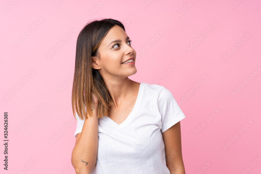 Young woman over isolated pink background thinking an idea Young woman over isolated pink background thinking an idea