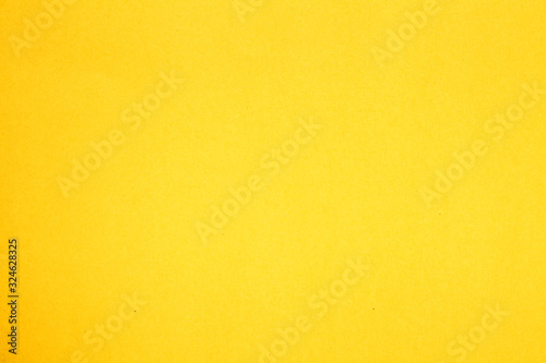 yellow sheet of colored paper background texture