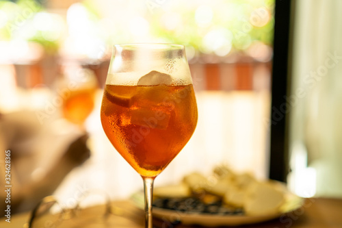 Glass with aperol spritz close up