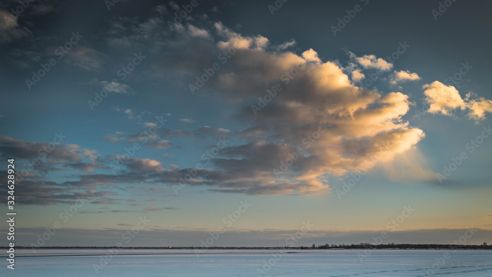 landscape of a sky with clouds. dark clouds and snow