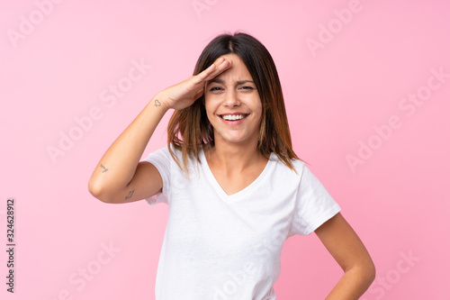 Young woman over isolated pink background has just realized something and has intending the solution