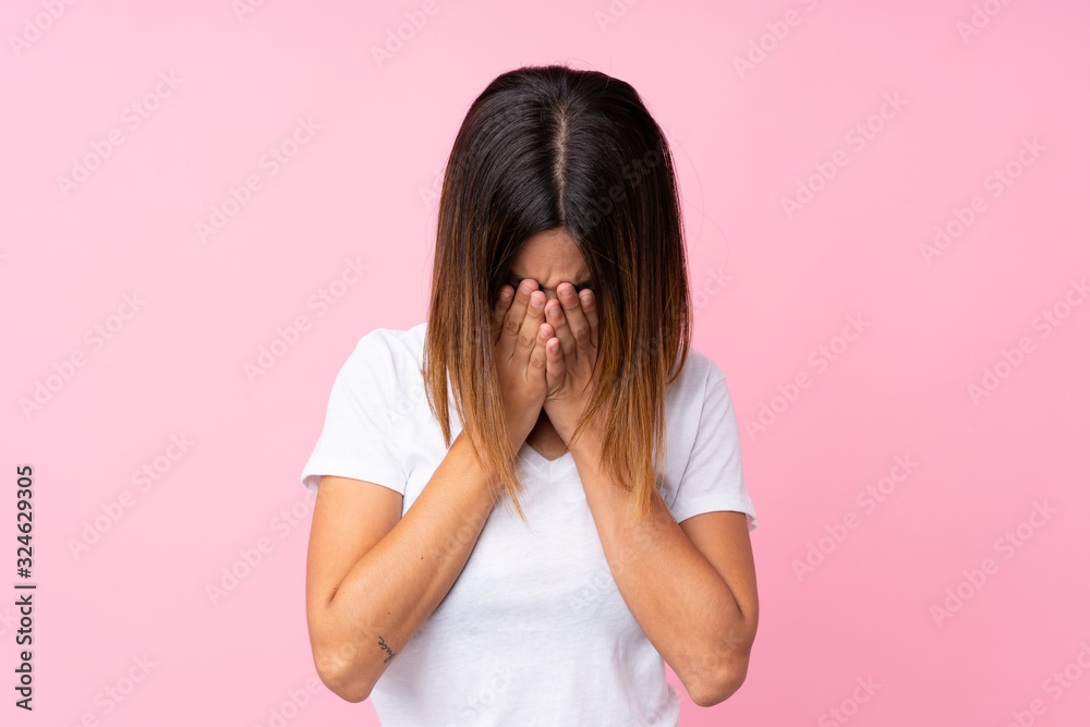Young woman over isolated pink background with tired and sick expression Young woman over isolated pink background with tired and sick expression