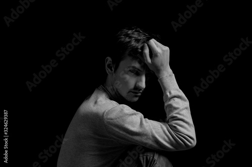 black and white dramatic photo in a depressed pose