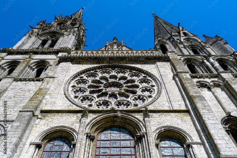 Chartres, Centre-Val de Loire / France - August 12th, 2009: Low angle of the Cathedral facade and its rose window