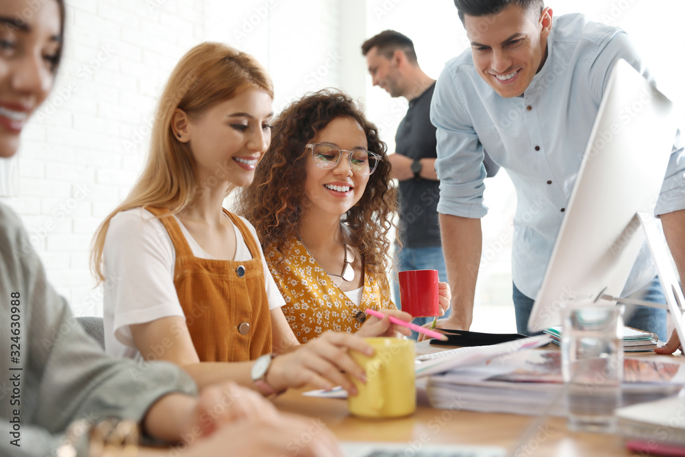 Team of professional designers working in office Team of professional designers working in office