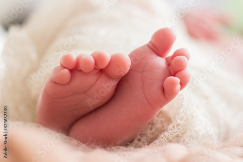 baby newborn foot finger closeup detail small leg feet