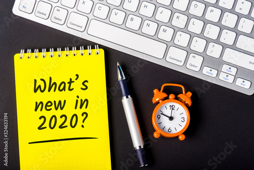 A note What's new in 2020 year. Changes coming in 2020. With office or school supplies photo