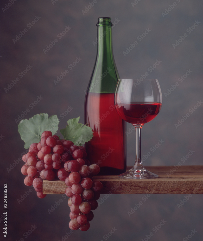 Red wine bottle, glass, grapes