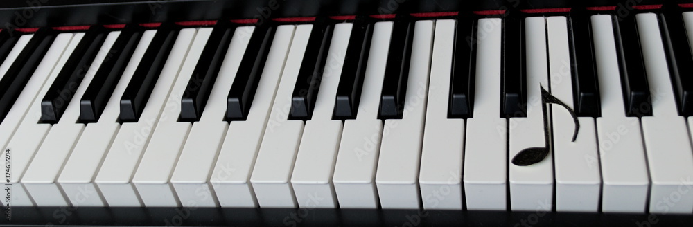 Musical note on a piano keyboard Musical note on a piano keyboard