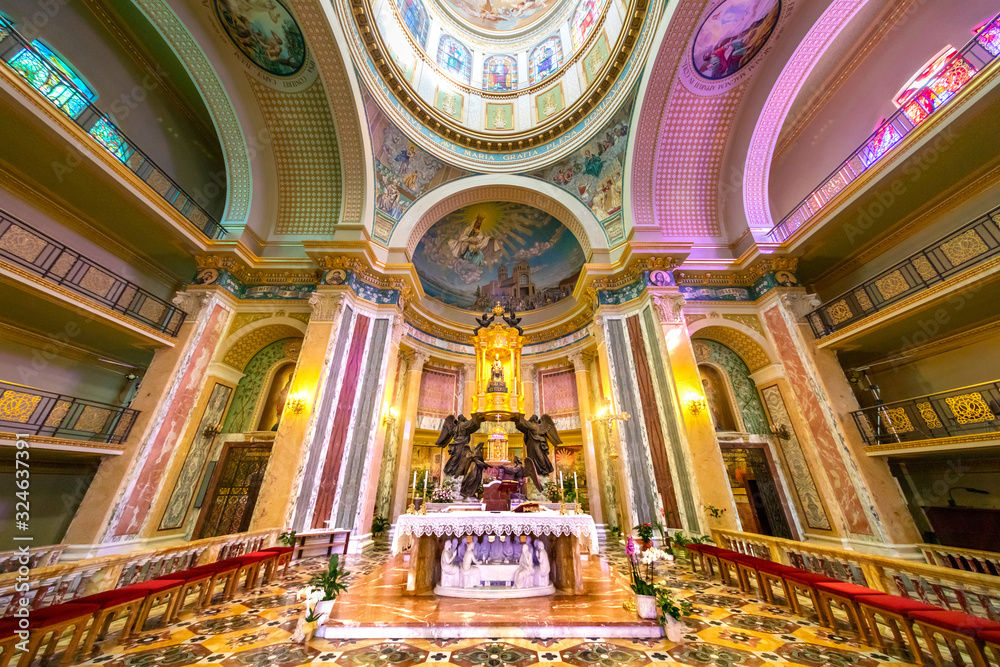 Symmetrical wide angle view of the apse of a colorful baroque Sicilian cathedral
