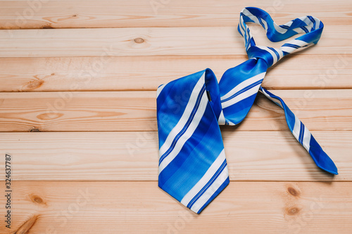 accessories for men. colorful ties on a wooden background. concept of happy father's day or shoppig photo