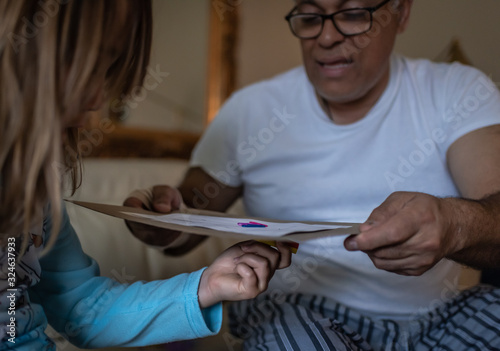 Father working on a science project with child at home, parental connection, homeschool, lifestyle