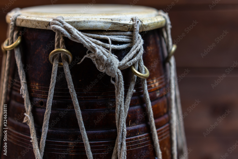 Hand drum on a wooden background