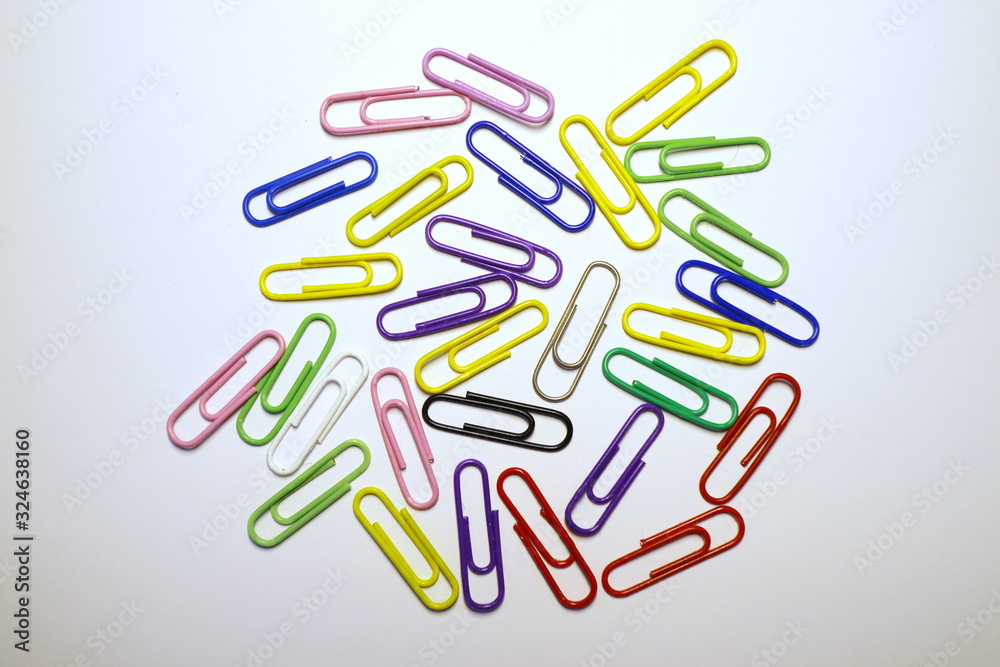Multicolored paper clips on a white background