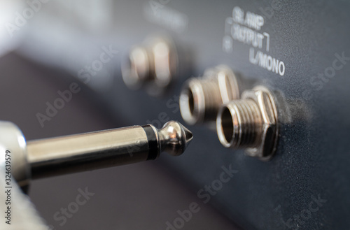 Jack plug and socket for electric guitar
