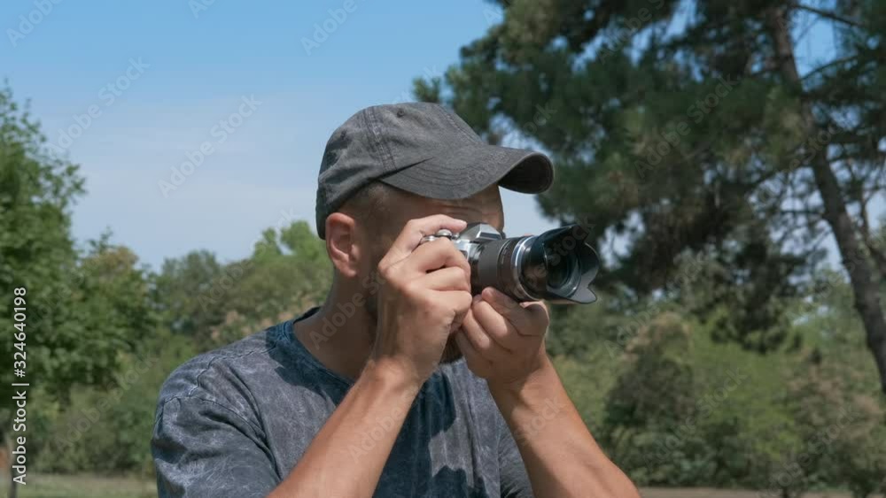 Man with professional camera in nature. Man with professional camera in nature.