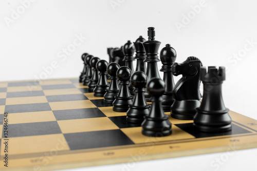 Black chess figures on the chessboard