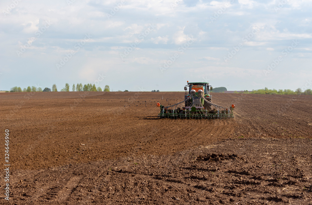 Fototapeta premium tractor working in the field