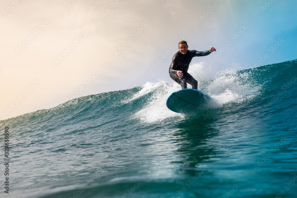 Surfer riding waves on the island of fuerteventura