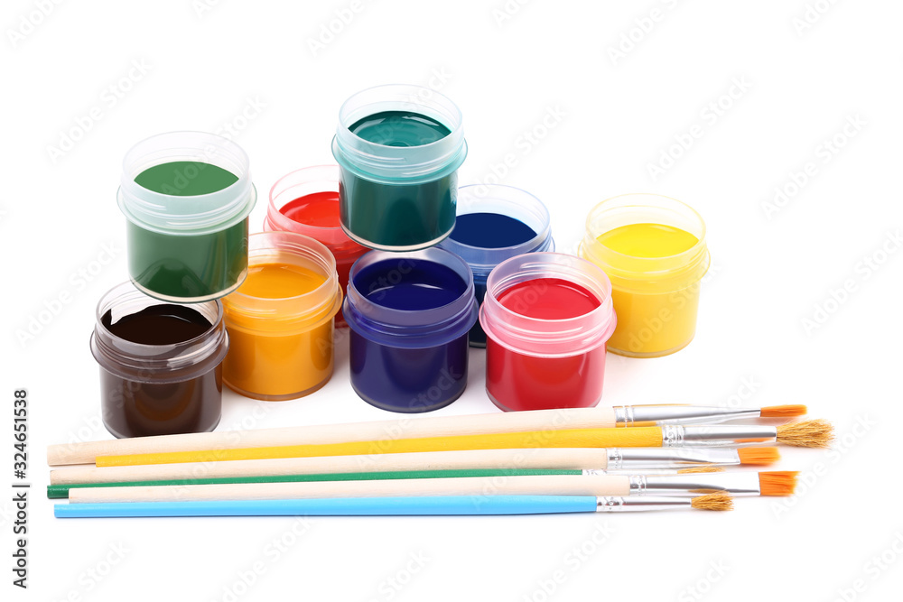 Colorful gouache paints and brushes isolated on white background Colorful gouache paints and brushes isolated on white background