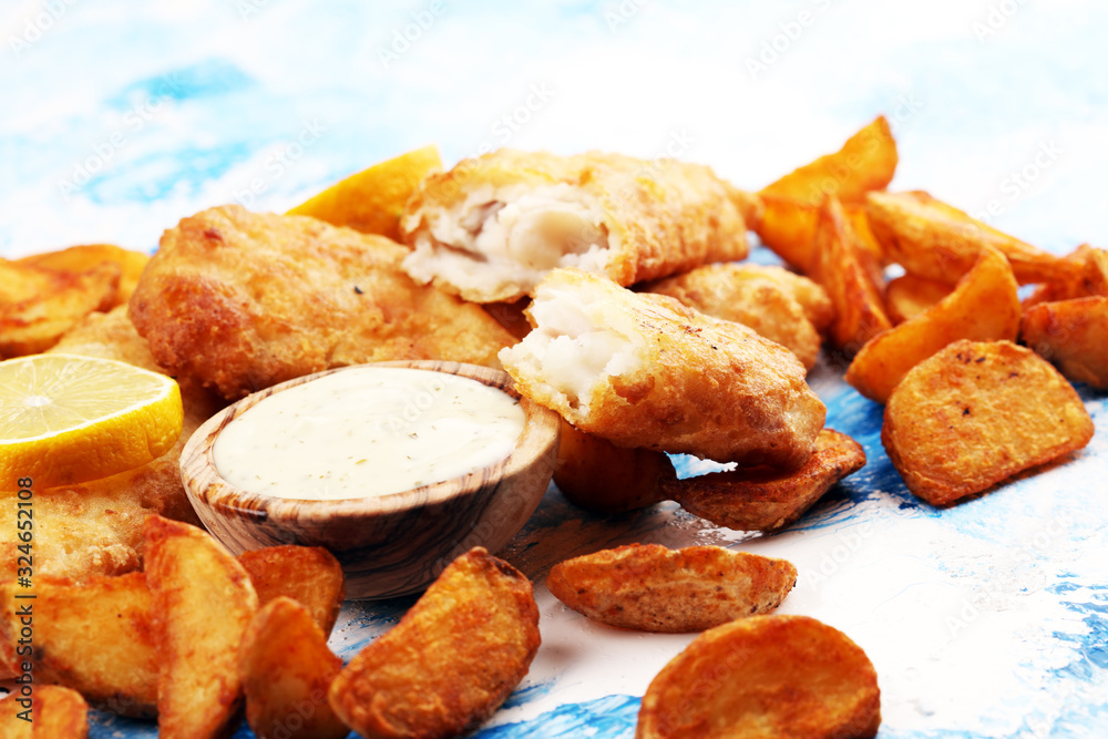 traditional British fish and chips consisting of fried fish, potato chips and mayonnaise traditional British fish and chips consisting of fried fish, potato chips and mayonnaise