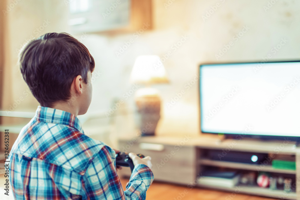 Young boy playing video game on console empty space Young boy playing video game on console empty space