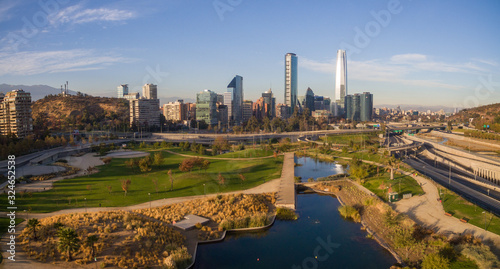 Aerial view of road jungtion and Manquehue hill from Vitacura bicentennial park on a clear day in Chilean capital Santiago photo