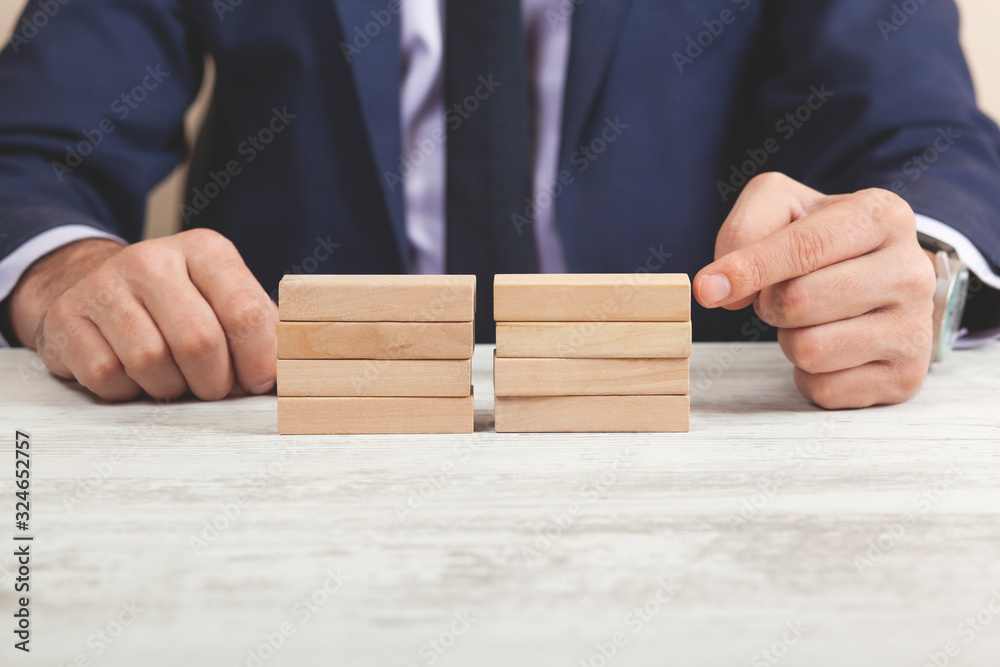 man hand wooden cubes on table man hand wooden cubes on table