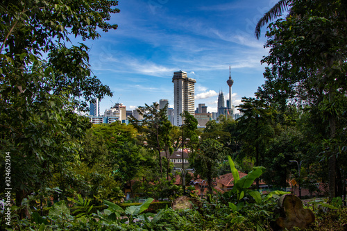 Modern skyscapers in business district in Kuala Lumpur, glass corporate buildings, urban scene. 