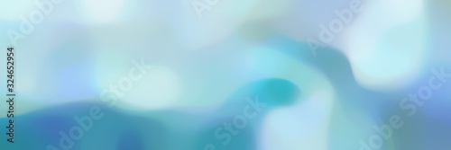 blurred bokeh landscape format background with light blue, steel blue and cadet blue colors and free text space