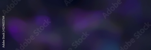 blurred bokeh landscape format background texture with very dark blue, very dark violet and black colors and space for text