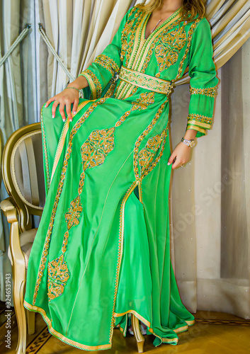 Moroccan caftan . Dressed by the Moroccan bride on her wedding day. Moroccan caftan is one of the most famous traditional clothing in the world