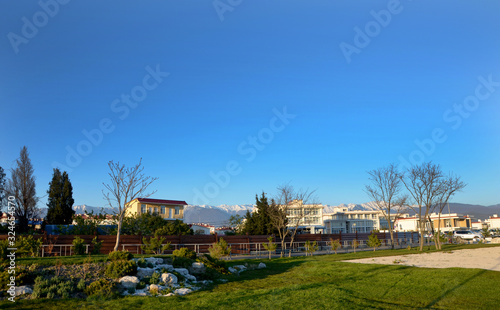 beautiful landscape with houses and mountains in the background