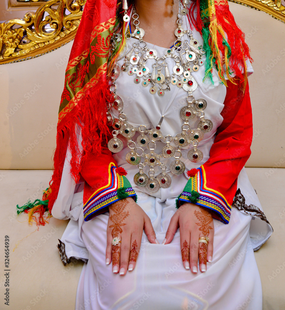 The dress of the Amazigh bride. The barbarian Moroccan bride. Henna and  jewels Photos | Adobe Stock
