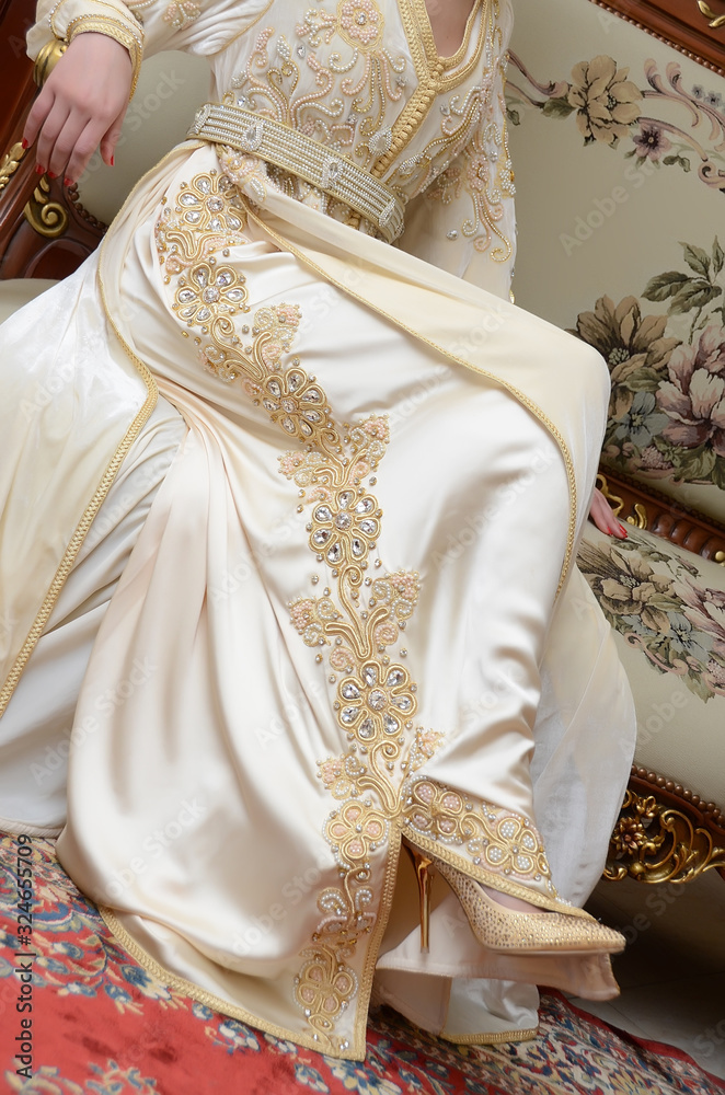  Moroccan caftan close-up. Gold embroidery. One of the most famous clothes in the world. The formal dress for women in Morocco