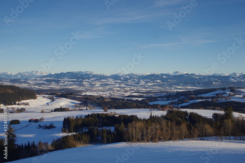 Landscape with little village on sunny winterday