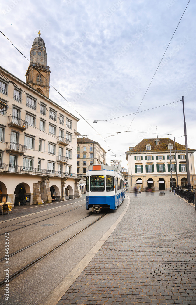 Obraz premium Zurich cityscape with blue tram in the old city center