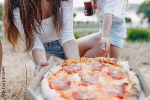 pizza on the lawn in boxes