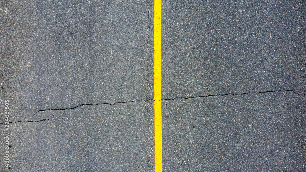 Fototapeta premium texture of asphalt with one big crack.