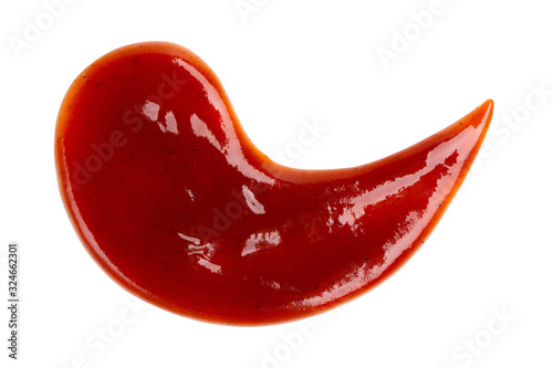 Drop of barbecue sauce or ketchup isolated on white background, top view, close up.