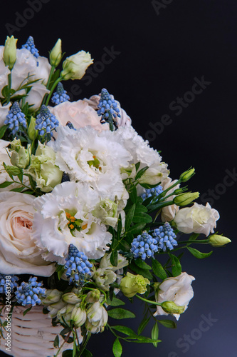 Bouquet. Composition of fresh, delicate flowers on a dark background.
